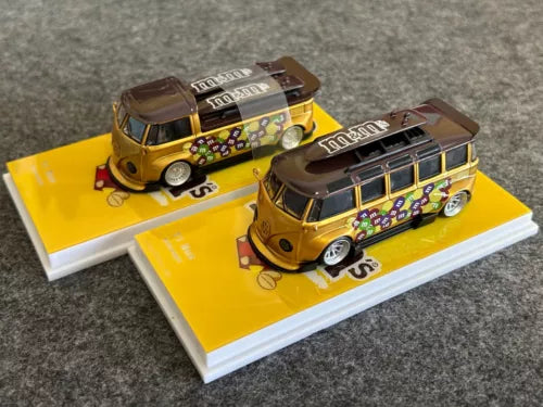 Yellow diecast VW T1 bus model cars, two-piece set on white display bases