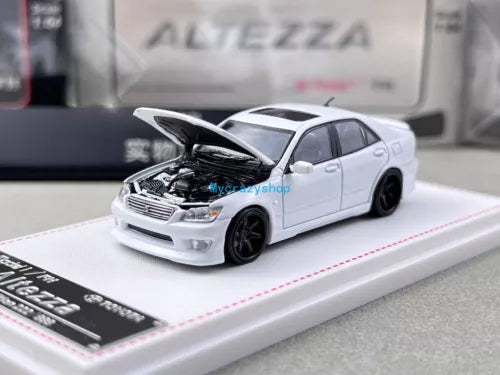 White diecast sports sedan model car with front-left view, black wheels