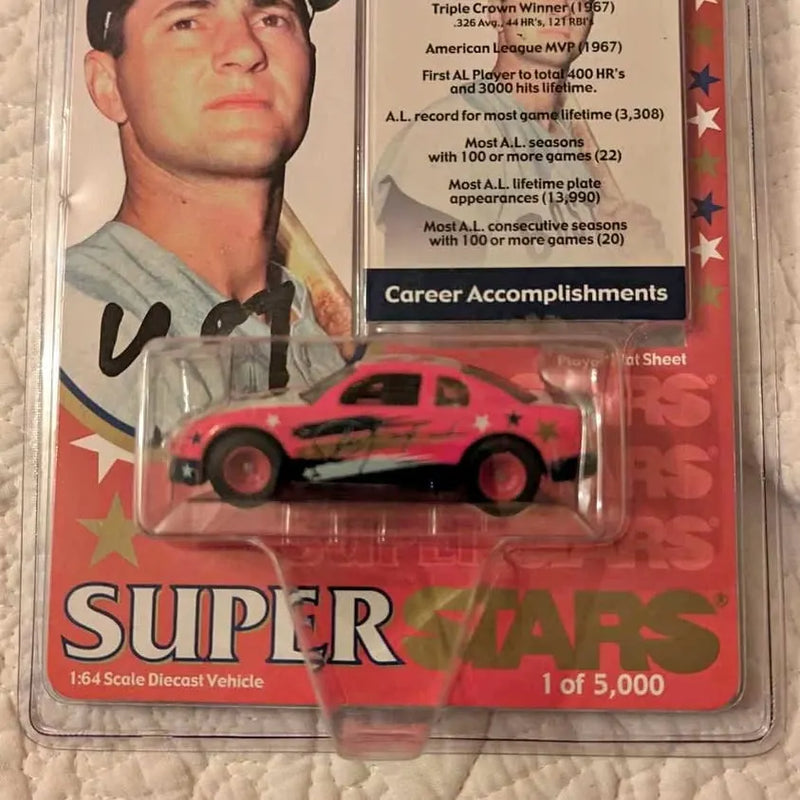 Limited edition diecast car with red and black body, star decals, in plastic blister