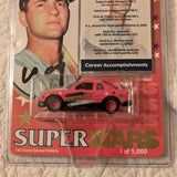 Limited edition diecast car with red and black body, star decals, in plastic blister
