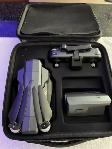 Drone with 4K camera in hard carry case, folded propellers and battery pack