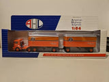 1:64 orange Mack truck tandem diecast model in retail box
