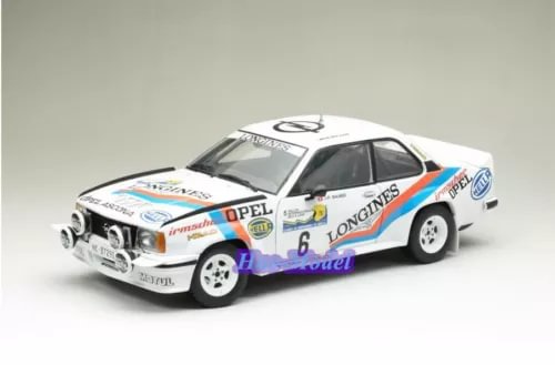 White diecast rally model car with blue stripes, number 6, front 3/4 view