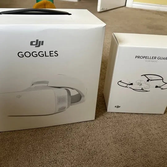 DJI drone goggles box with propeller guard box, showing goggles and guard graphics