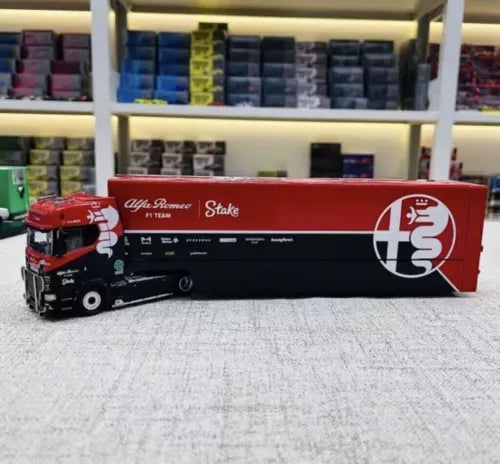 Red and black enclosed double-deck truck model diecast, side view with decals