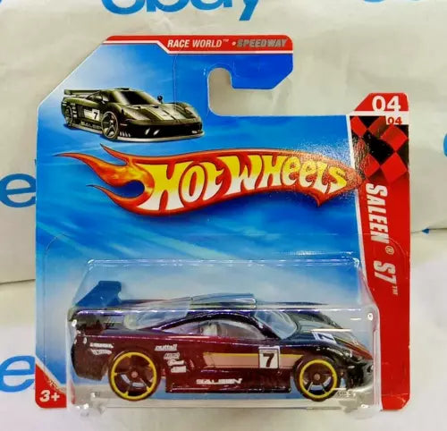 Hot Wheels 1:64 diecast race car in maroon with gold wheels on blister card