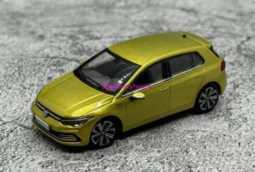 Green diecast model hatchback car toy with front 3/4 view and black accents