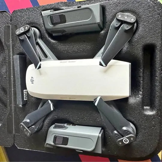 DJI Spark drone with folded arms, showing gimbal and camera