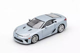 Diecast model car of a light gray coupe with ice blue and orange accents