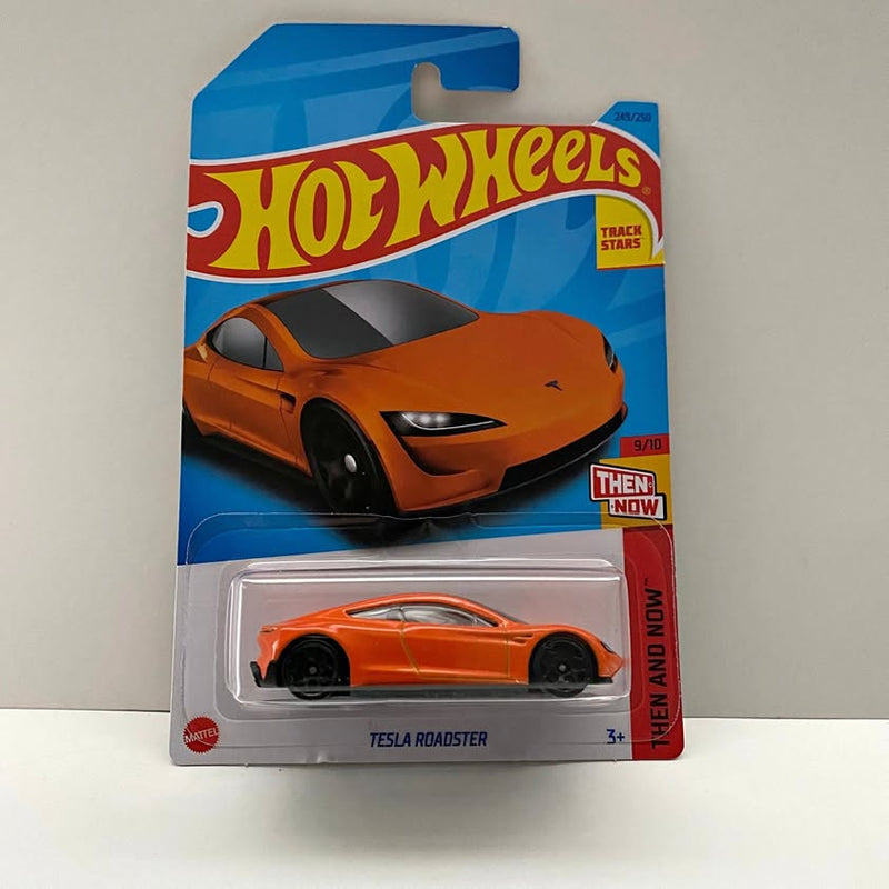 Orange Tesla Roadster diecast toy car on blister card