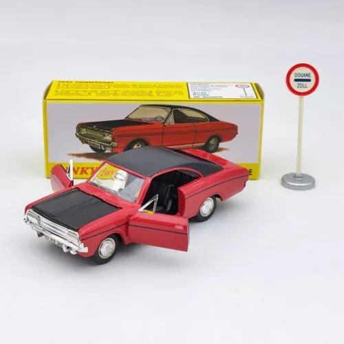 Red diecast car model with open door and boxed packaging