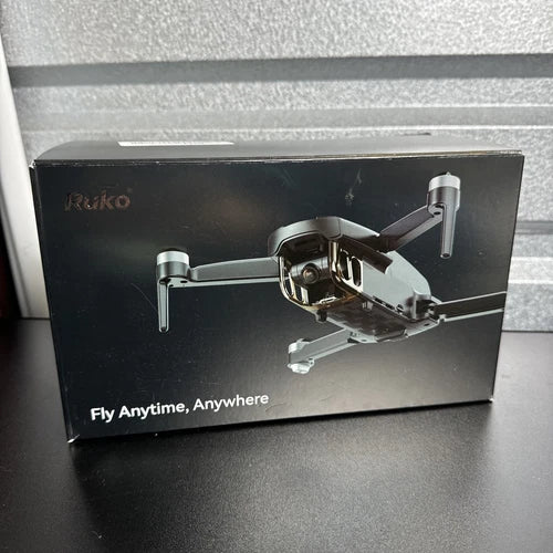 Ruko GPS drone box with 4K camera and three batteries, showing folding quadcopter design