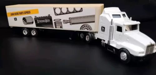 White diecast semi truck with detailed cab and Parts Express trailer, multi-axle wheels