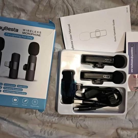 Wireless microphone kit with two microphones, charging cable, and carrying case