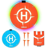 Portable round drone landing pad set with compass design, orange/blue pads, and mounting hardware