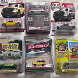 Diecast model car in blister packaging with yellow and black vehicles
