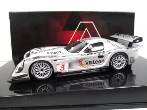 White diecast race car model with Visteon logos and red #3, on display base