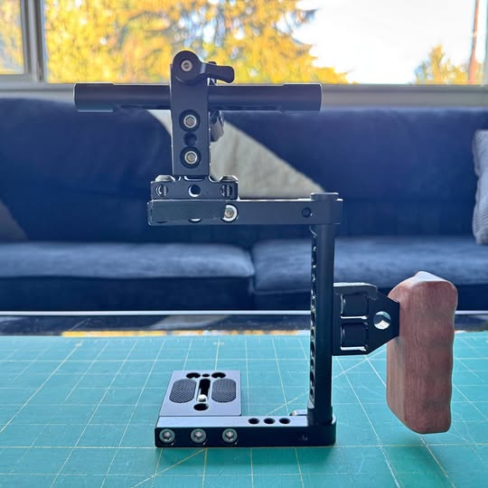Metal camera cage with wooden top handle and mounting plate