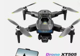 Camera drone with four propellers, front view, dark gray and black body