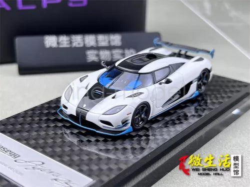 1:64 scale white sports model car with blue accents on black display base