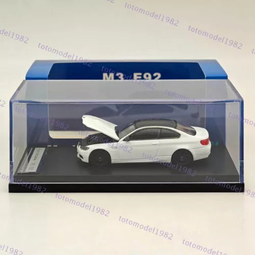 Pearl white diecast model car in display box, rear three-quarter view, 1/64 scale