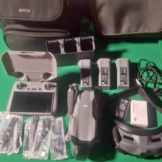 DJI Air3 drone with controller, batteries, charging cables, and accessory case