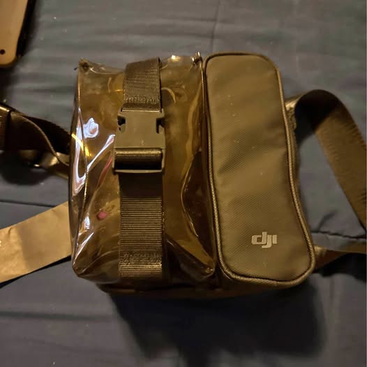 DJI drone travel carrying case with shoulder strap, zipper, molded interior insert