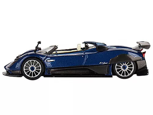 1:64 diecast roadster model car in blue with carbon-style trim, side view