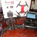 Red and black quadcopter racing drone with four propellers
