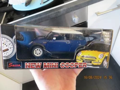 Blue mini cooper diecast model car in retail display box