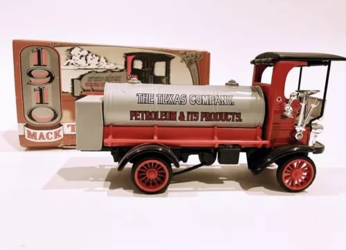 Red and cream diecast Texaco tanker coin bank with Mack cab and wheels