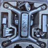 Gray 3DR drone with arms and front body in protective case