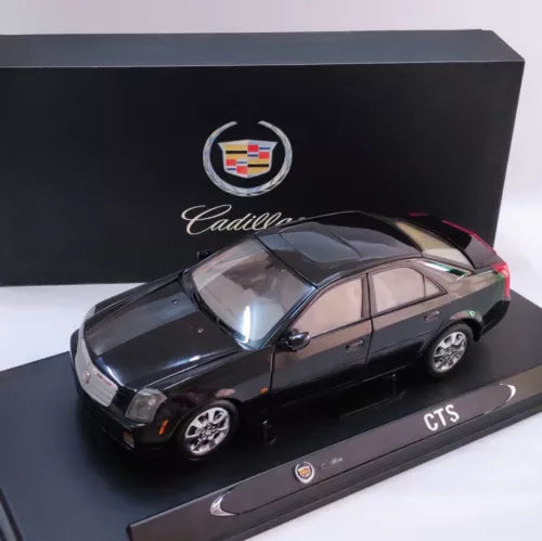 Cadillac CTS 2004 diecast model sedan, dark gray, with display base
