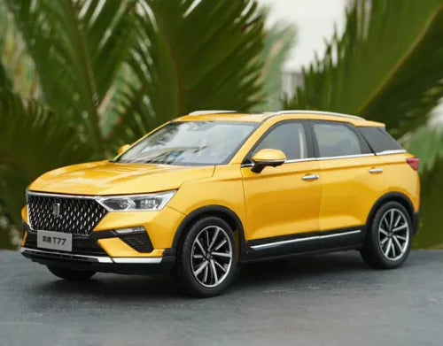 Yellow diecast SUV model car in front 3/4 view, detailed grille and headlights