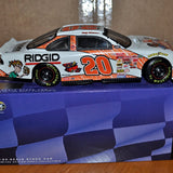 Diecast race car with Ridgid decals, orange/white body and #20 on door.
