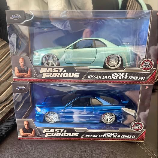 Fast and Furious diecast car set in retail boxes, blue and mint cars with alloy wheels
