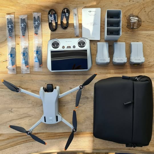 Foldable quadcopter drone kit with carrying case, batteries, and charging hub