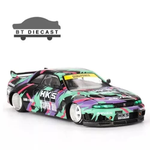Diecast race car toy, green and black multicolor livery with white wheels, front 3/4 view