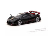 Diecast model car, black with gold stripe and red accents, front three-quarter view