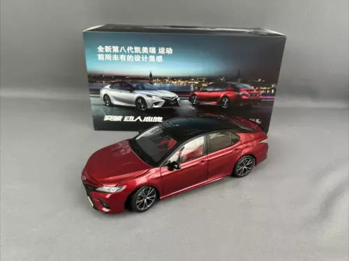 Red 1:18 diecast sports sedan model with packaging box