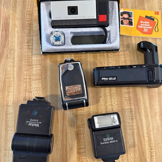 Camera accessory kit with flash and light accessories in open case