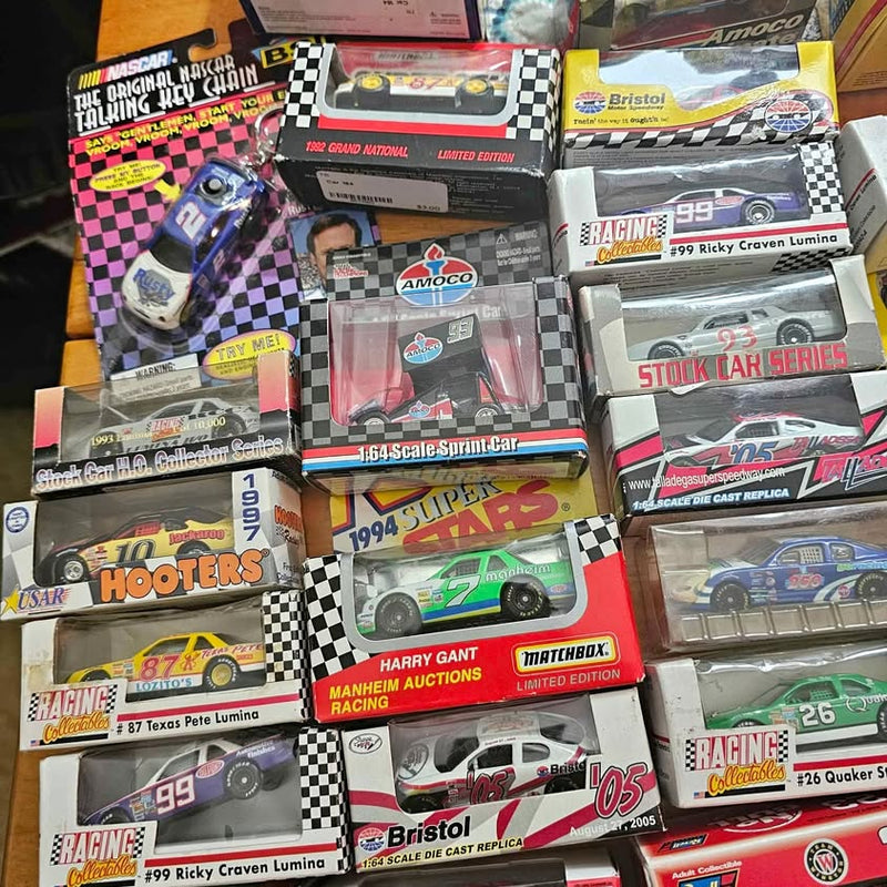 Boxed NASCAR diecast race cars display set with checkered racing graphics