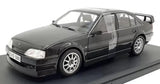 1/24 scale diecast sedan model in dark gray/black, front three-quarter view