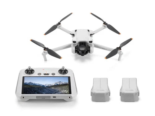Camera drone with gray controller and two spare batteries
