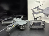 Gray quadcopter drone with remote controller and attached camera gimbal