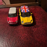 Mini diecast cars, red and yellow with Union Jack roof