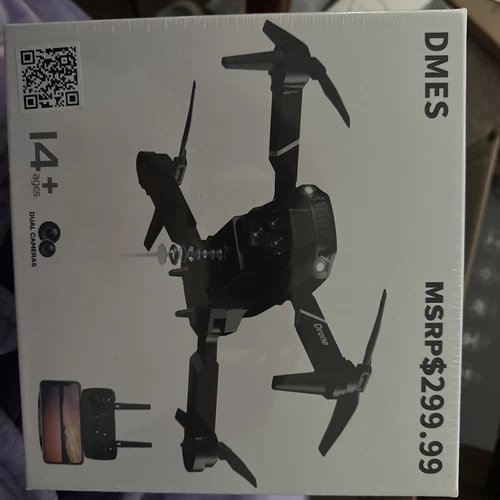 DMES camera drone, dark gray/black foldable propellers shown on box