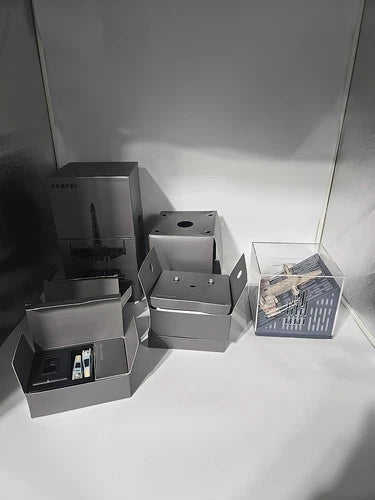 Collectible battling drone kit with gray storage trays, boxes, and spare parts