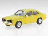 Yellow 1979 compact diecast model car, front three-quarter view with chrome grille