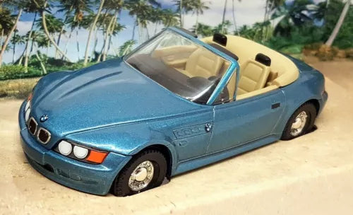 Blue diecast convertible model car toy with black grille and headlights
